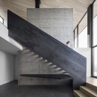 Bourgeois/Lechasseur nestles Quebec home with metal staircase into snowy hillside