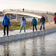 Raised stepping stones allow Dutch bridge to remain accessible during a flood