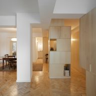Cubículo Arquitectos installs birch-plywood storage units inside Porto flat