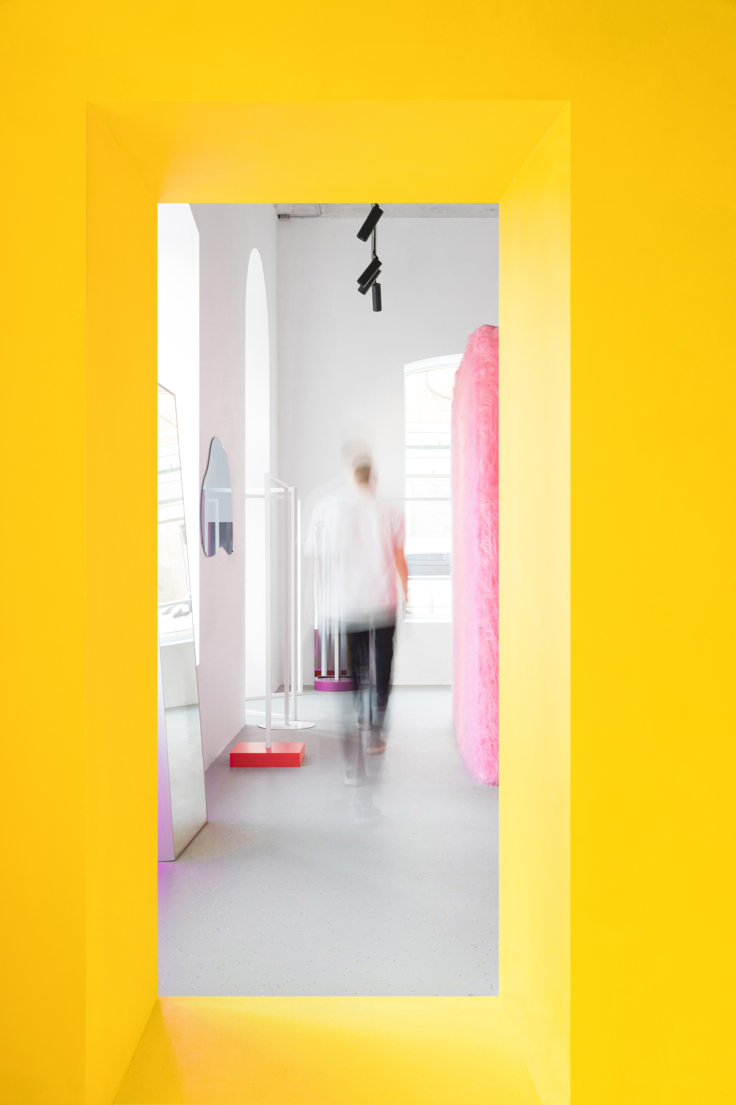 Pink furry walls and vibrant yellow surfaces brighten Russian