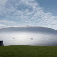 The sports hall designed by local architecture office Sporadical adjoins a recently modernised and extended primary school in the town of Dolní Břežany