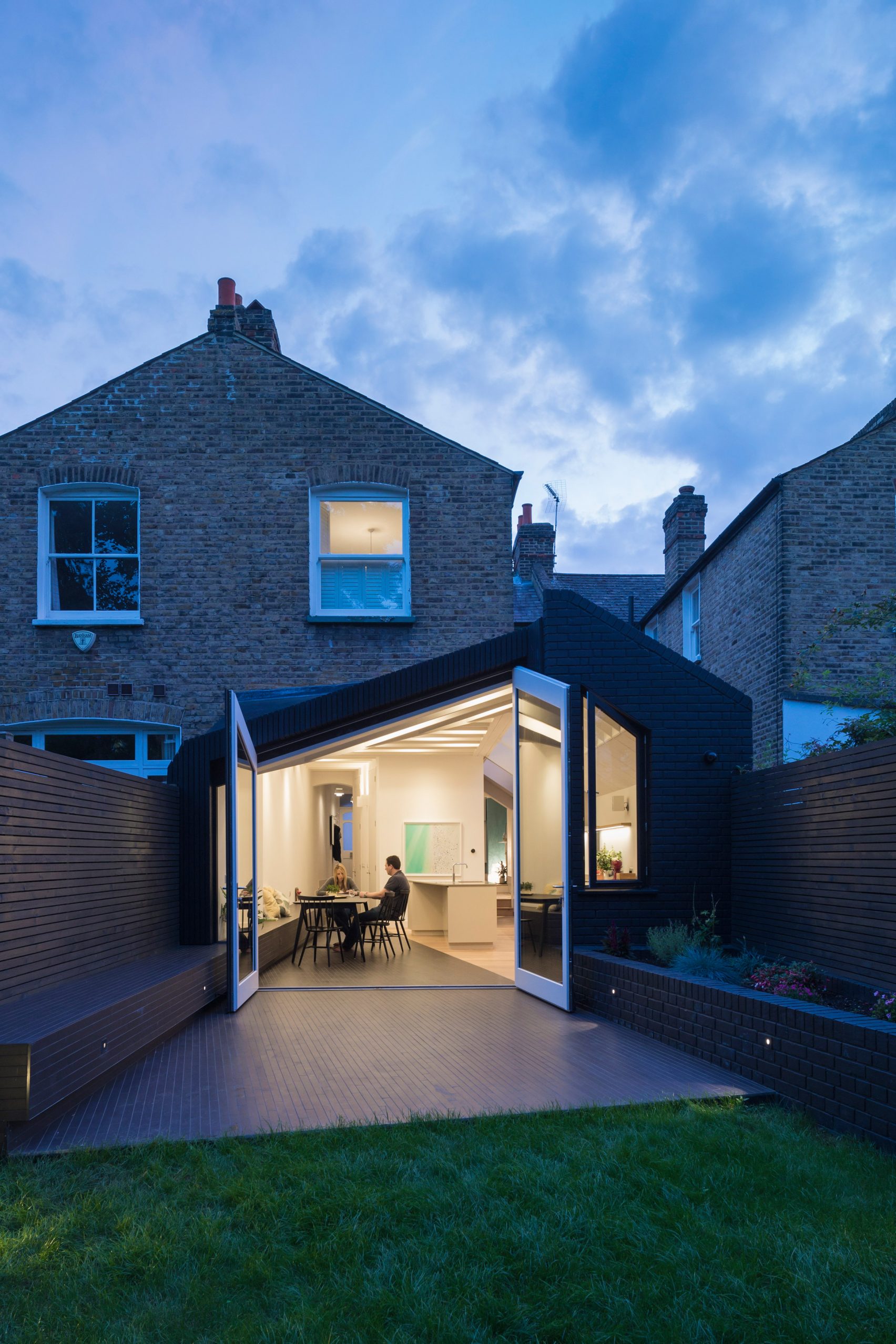 Angular Doors Connect Tapered Extension By Mustard Architects With Patio