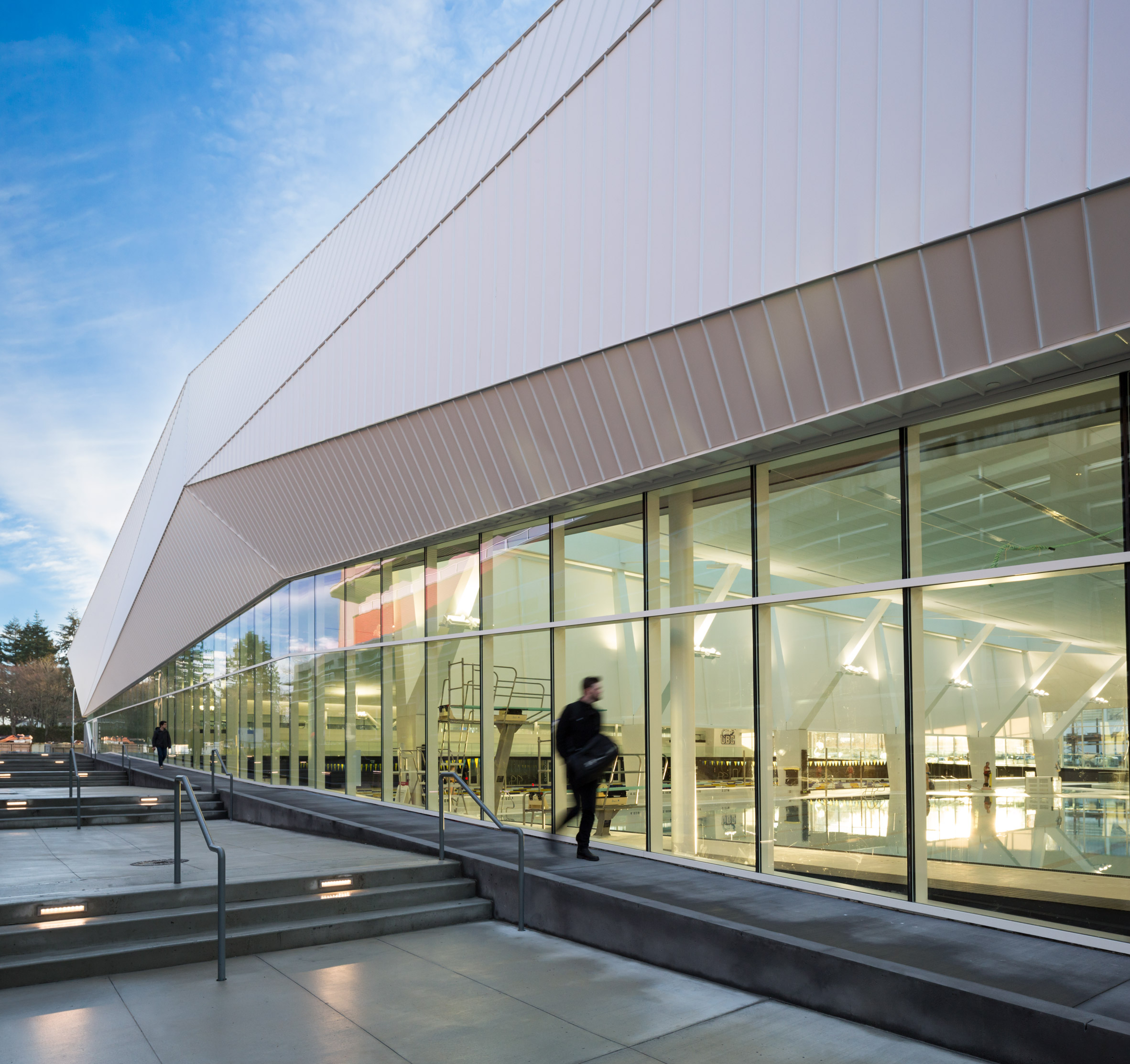 Angular white roof covers MJMA's glazed aquatic centre in Vancouver
