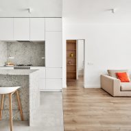 Raúl Sánchez Architects updates Barcelona flat with grey granite and bright white walls