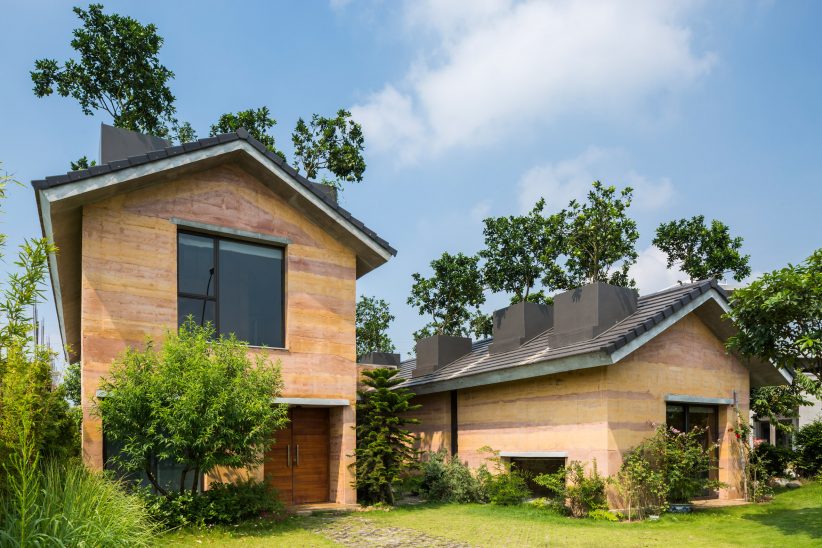 Trees Grow From The Roofs Of Vo Trong Nghias Stripy Rammed Earth House