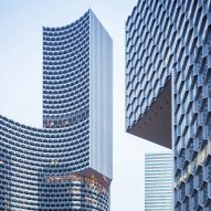 Honeycomb-patterned towers by Büro Ole Scheeren frame gardens in Singapore