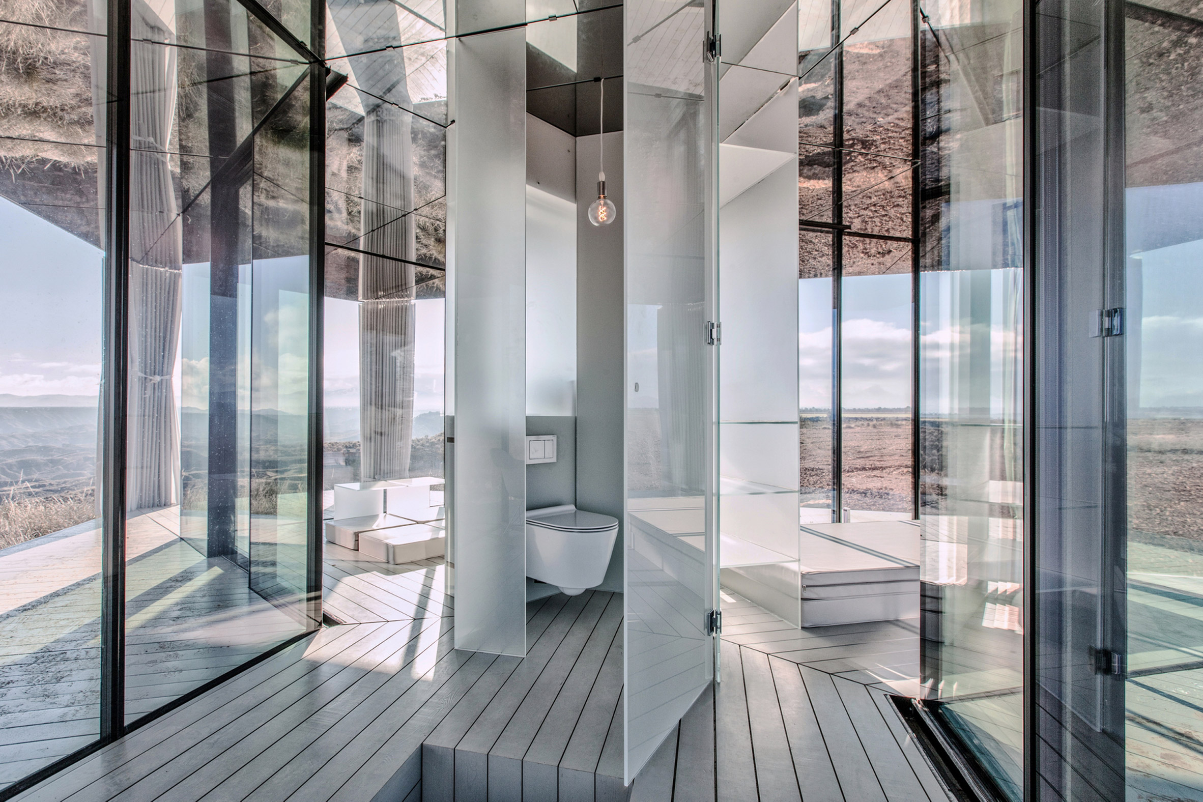 Glass Pavilion by OFIS Arhitekti provides a platform for star gazing in a Spanish desert