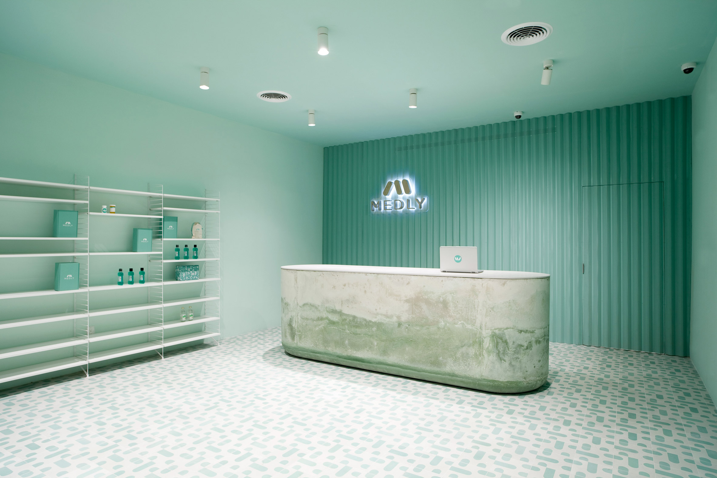 Pharmacy waiting room in Brooklyn features calming turquoise tones