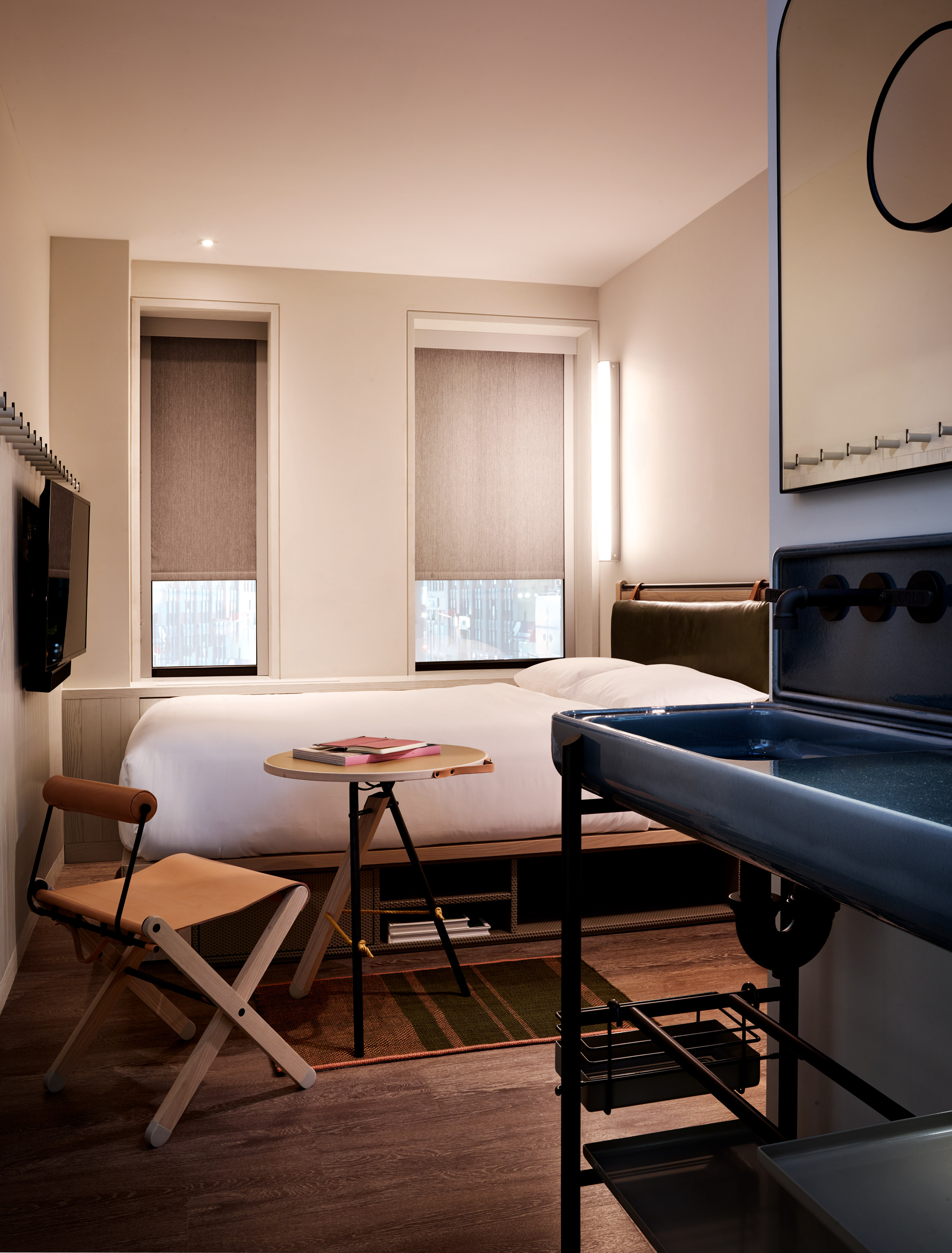 Foldaway chairs and bunks furnish bedrooms at Moxy Times Square hotel