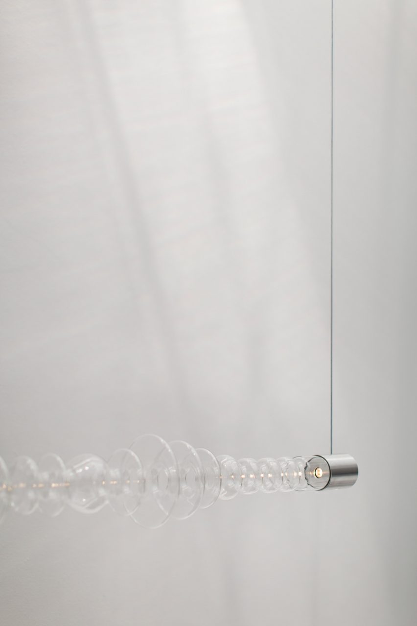Mayice Studio creates sculptural lamp from curving glass tube