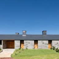AE Arquitectos builds stable in Mexico from grey volcanic rock