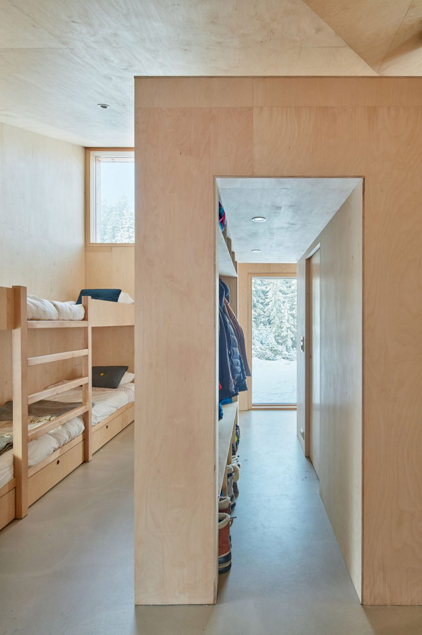 Bunk bed in timber-clad house by Mork-Ulnes Architects