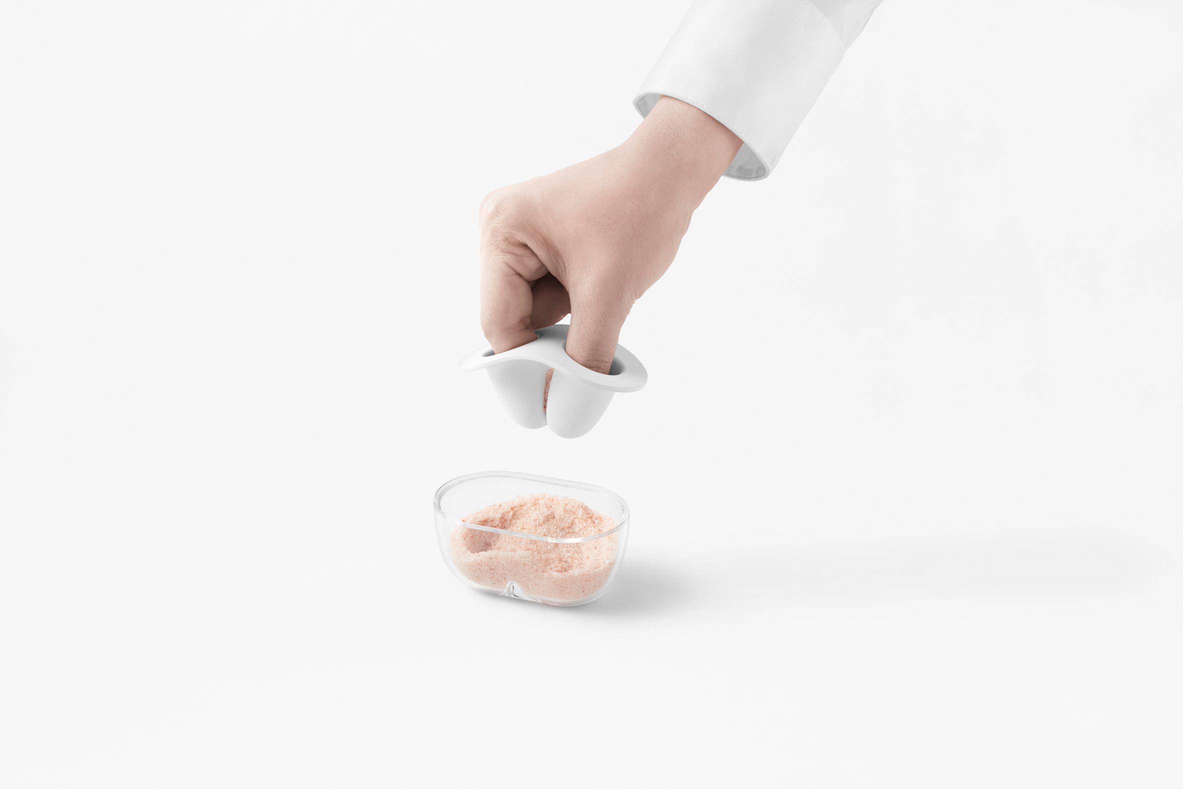 Nendo creates kitchenware lids that imitate hand movements