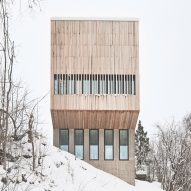 Timber-and-glass boxes contain pair of residences on a Norwegian hillside