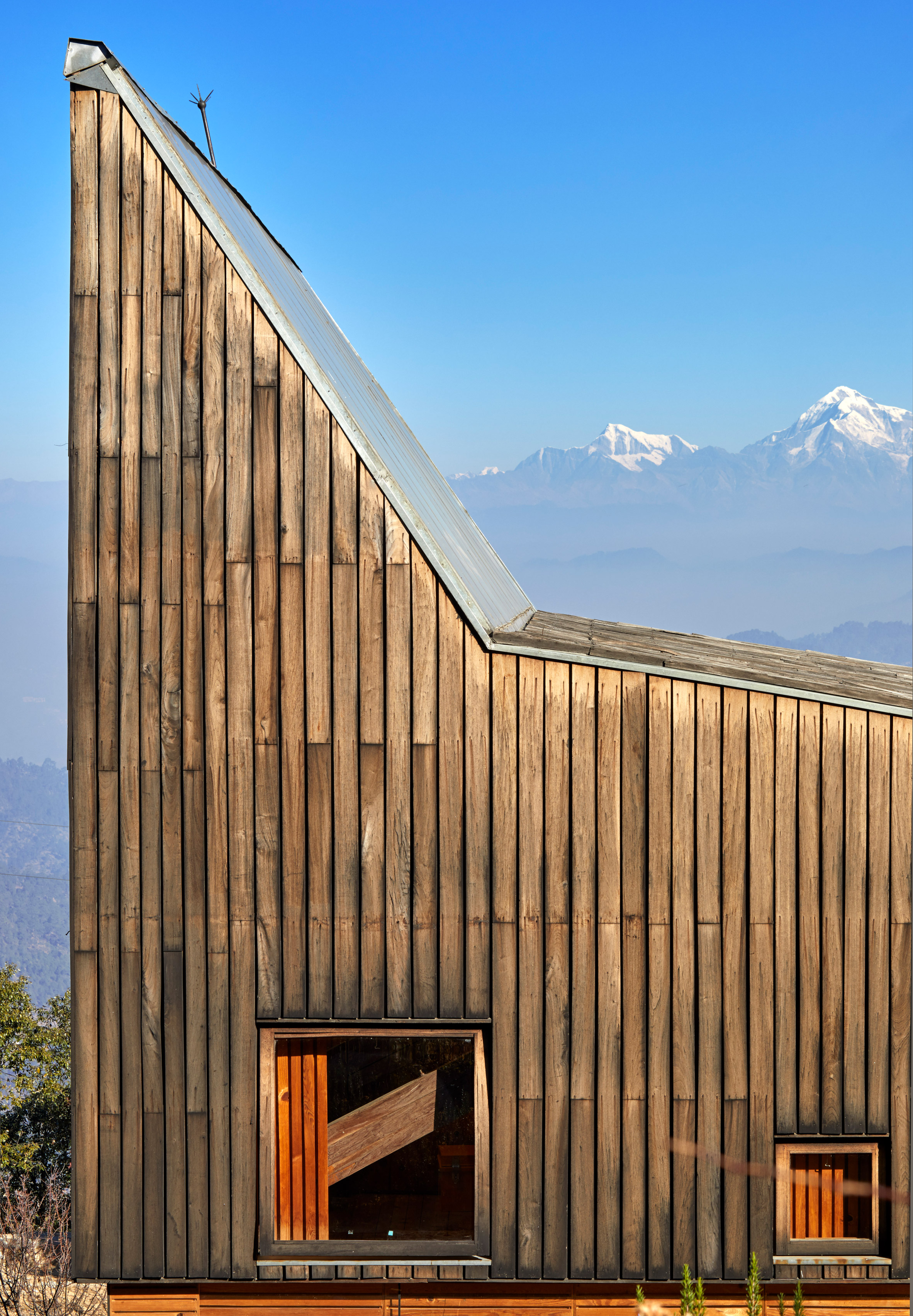 Matra Architects creates holiday home with peaked roof and Himalayan views