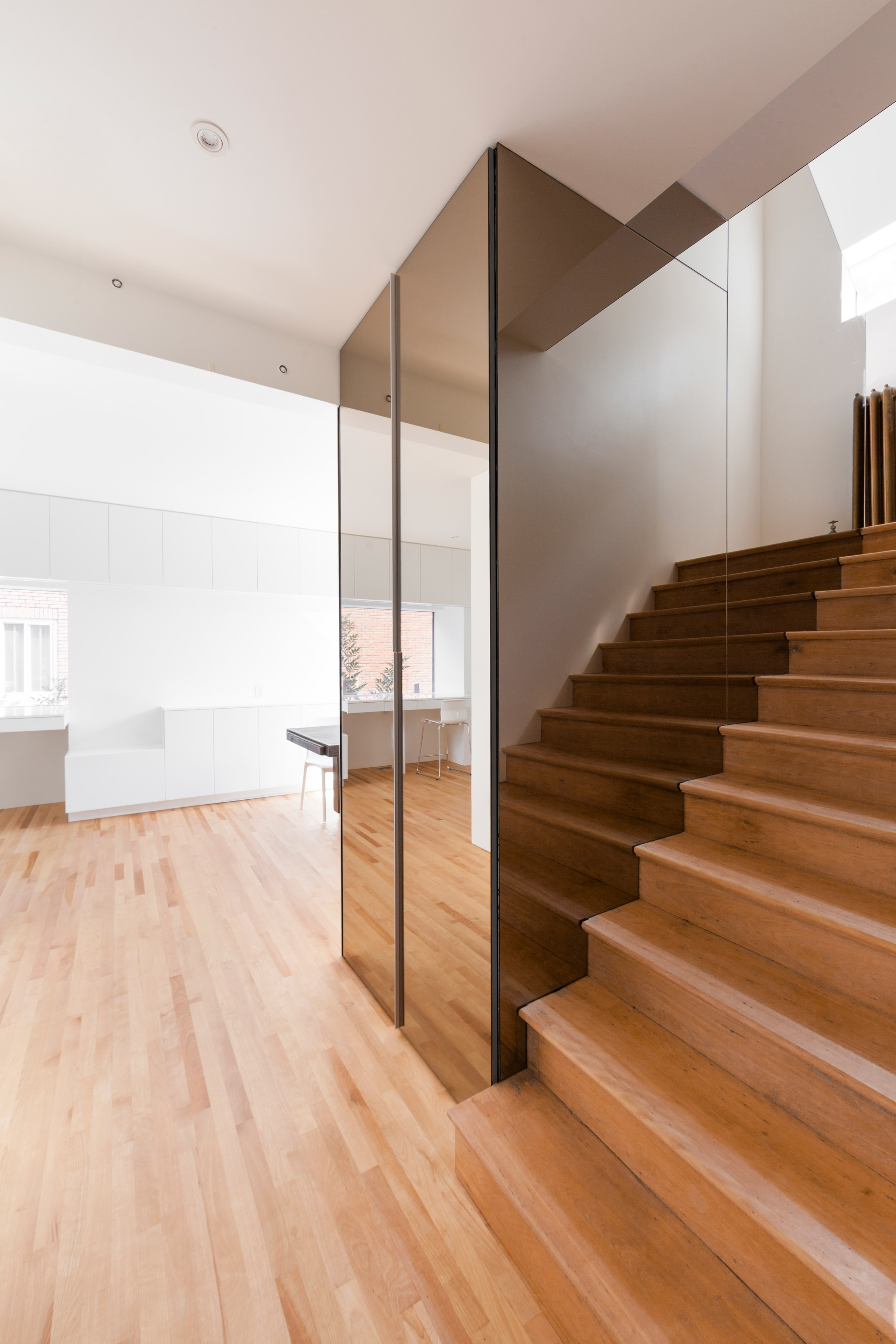 Jean-Maxime Labrecque adds mirrored staircase to Playful Tudor home in Montreal