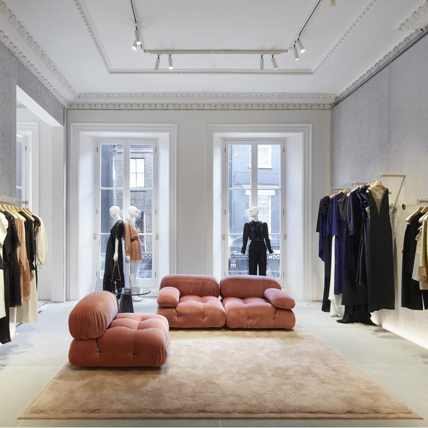 Pink Mario Bellini sofas from Stella McCartney's personal collection sit on the womenswear floor
