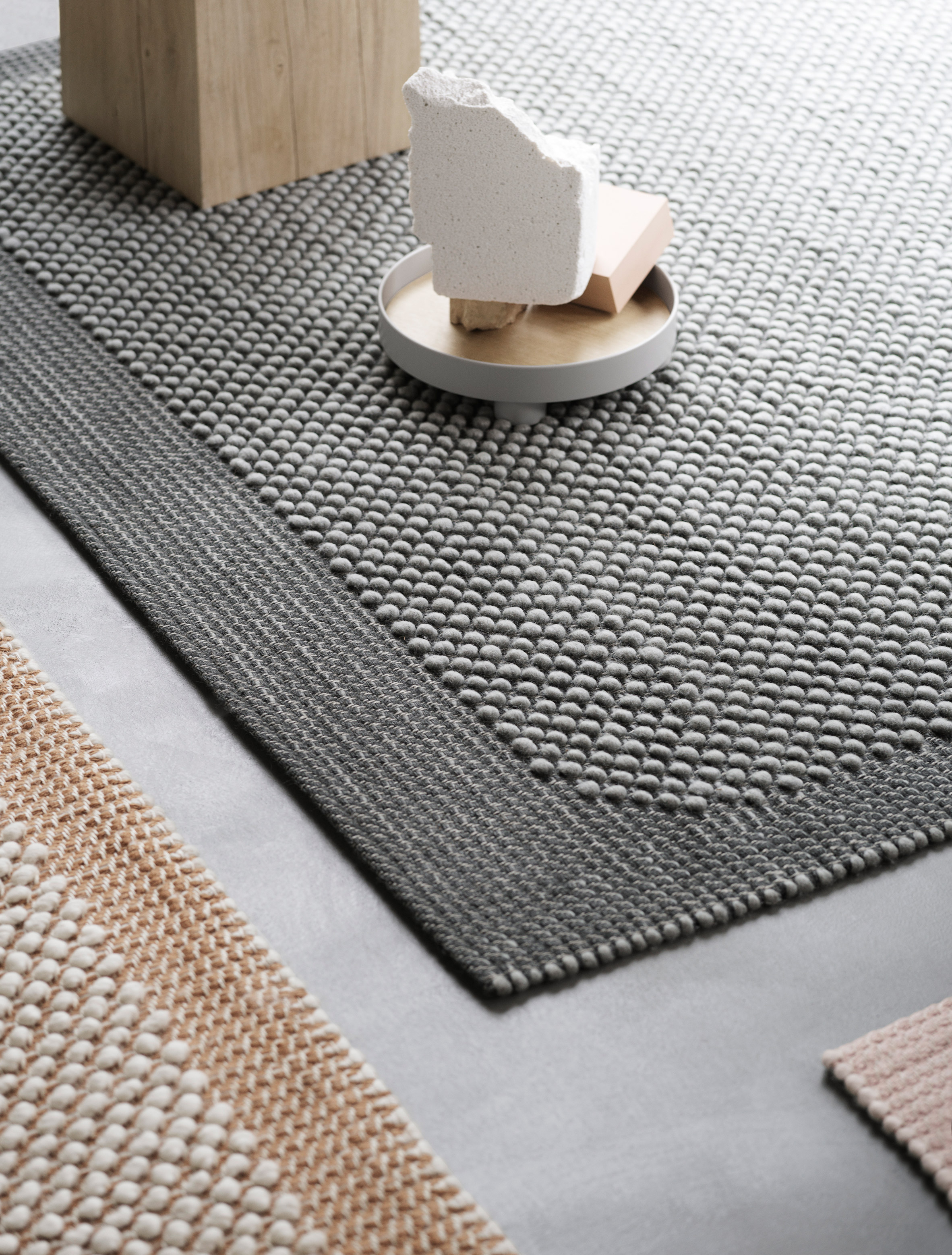 Muuto debuts bobbly rugs that feel like pebbles underfoot