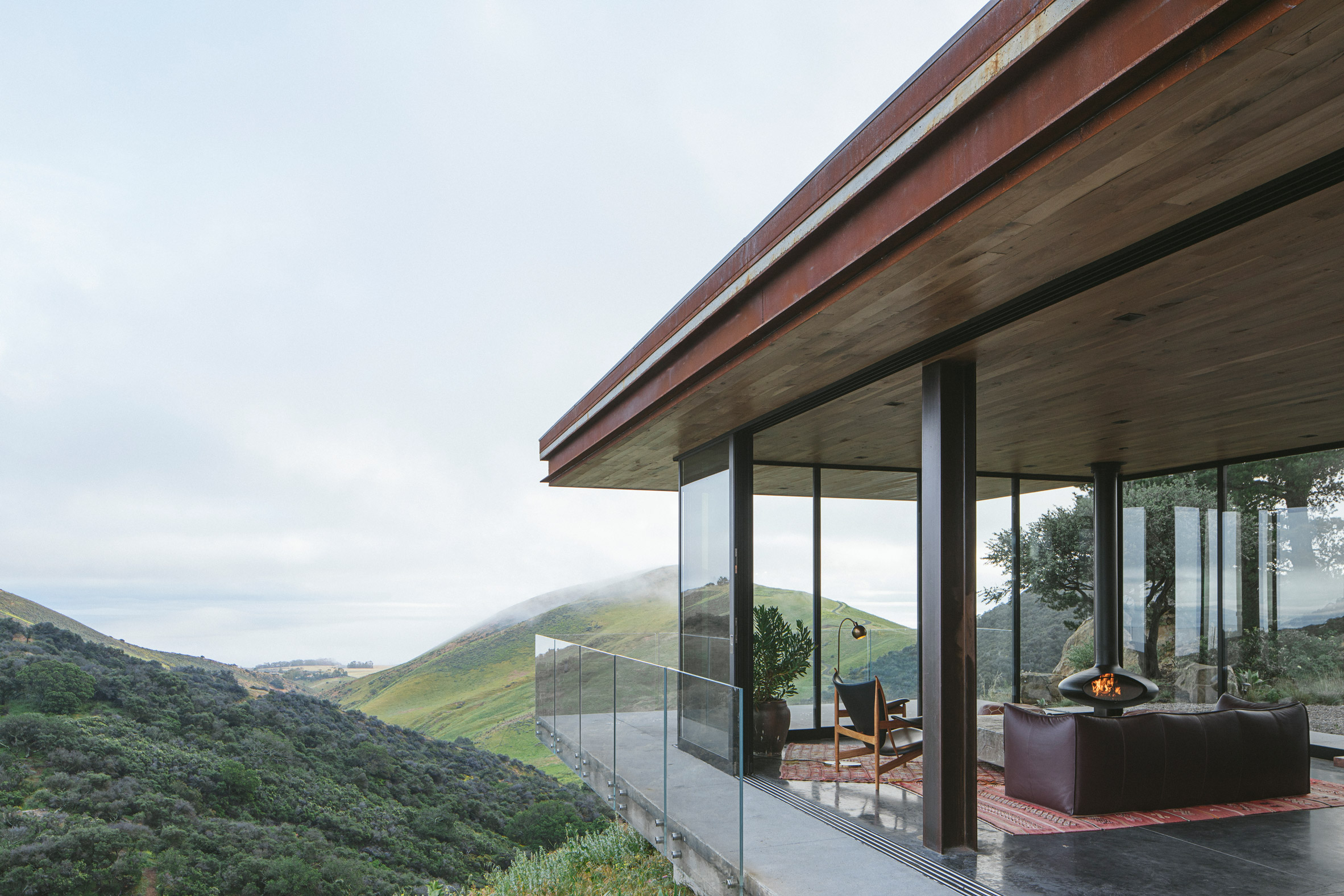 Off-Grid Guest House cantilevers over hillside with Pacific Ocean vistas