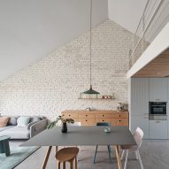 HAO Design uses pastel hues for pitched-roof apartment in Beijing