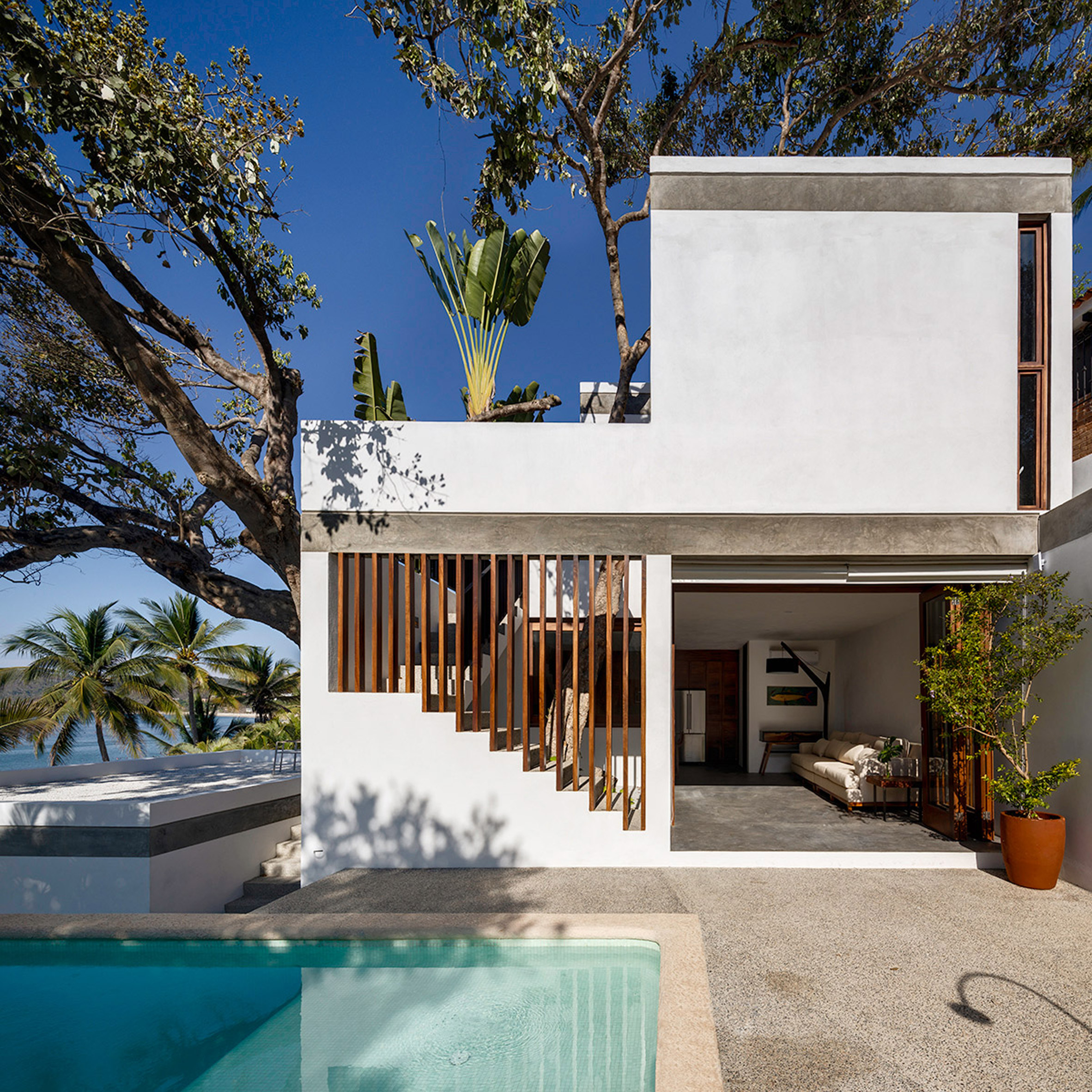 Main Office staggers Casa LT down lush slope in Mexican surf village