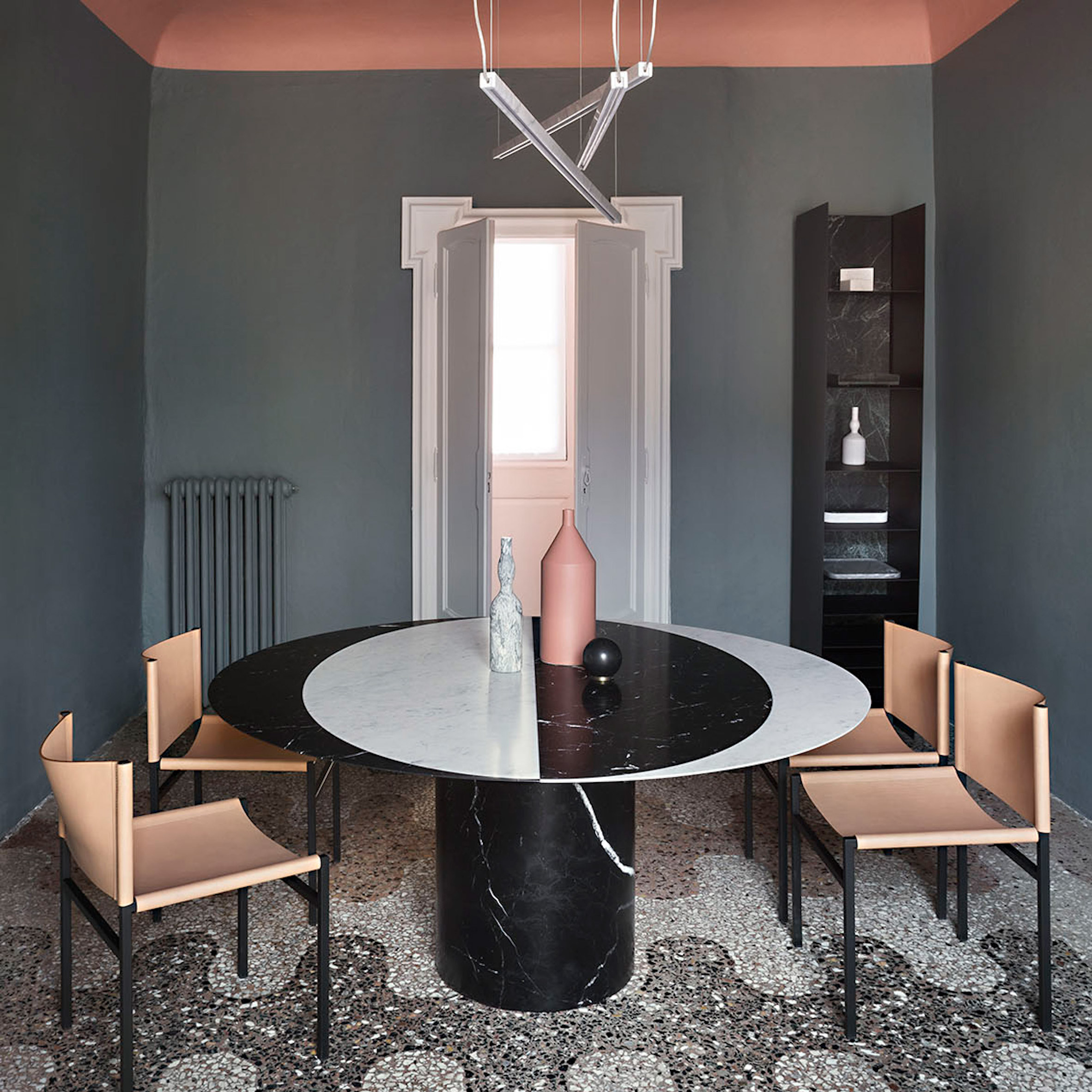 Casa Salvatori in Milan pairs marble furnishings with flecked