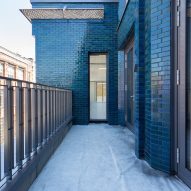 Iridescent turquoise tiles cover Damien Hirst's new flagship studio by Stiff + Trevillion