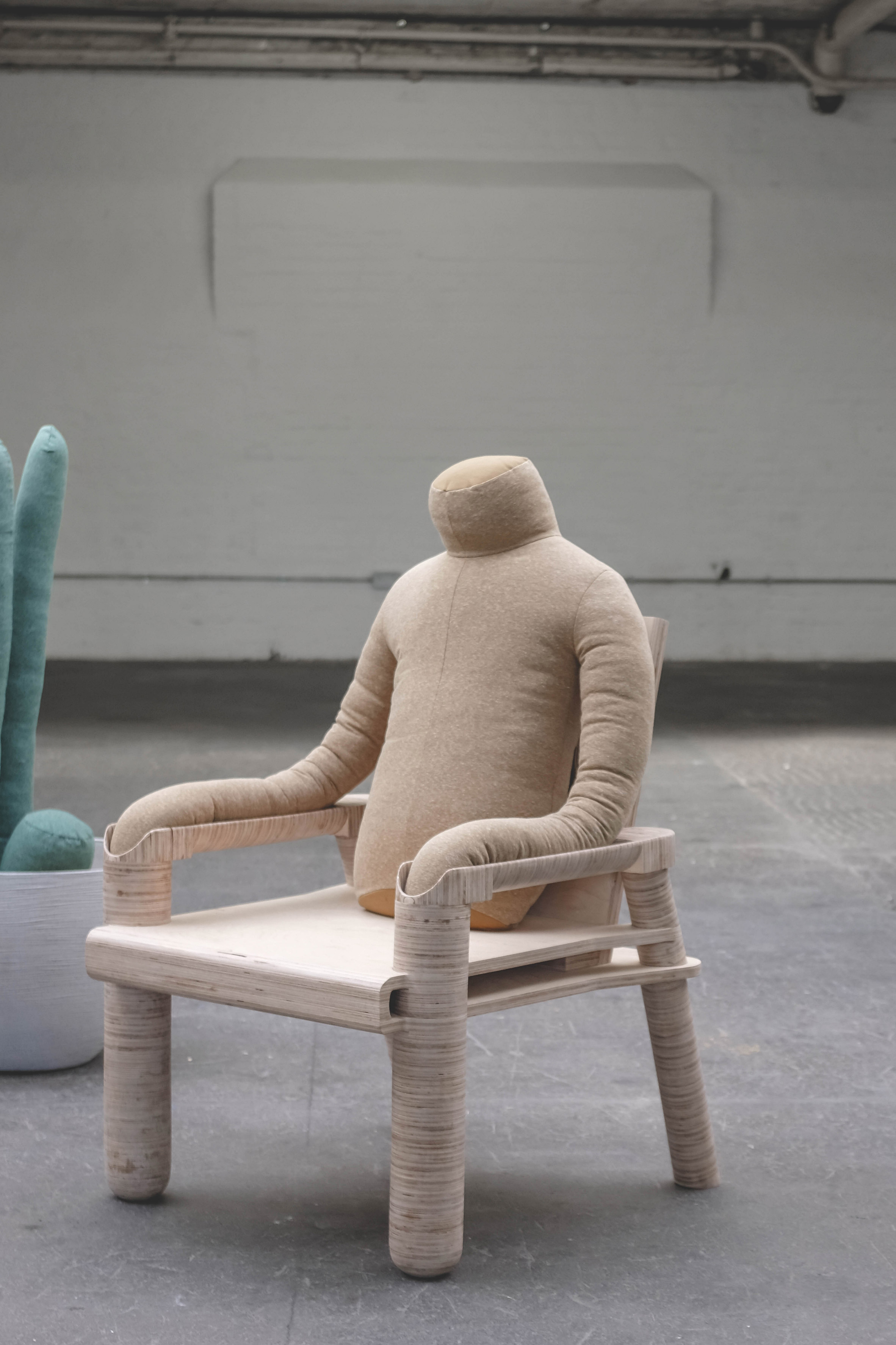 Headless human-shaped pillow by Aseptic Studio designed to reduce urban loneliness