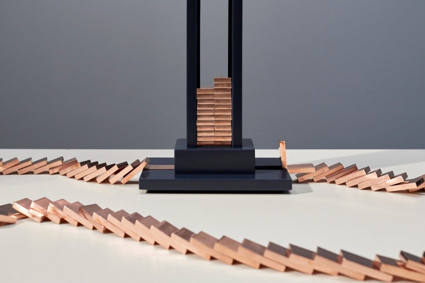 Glithero's interactive lamp is illuminated by a toppling row of dominoes