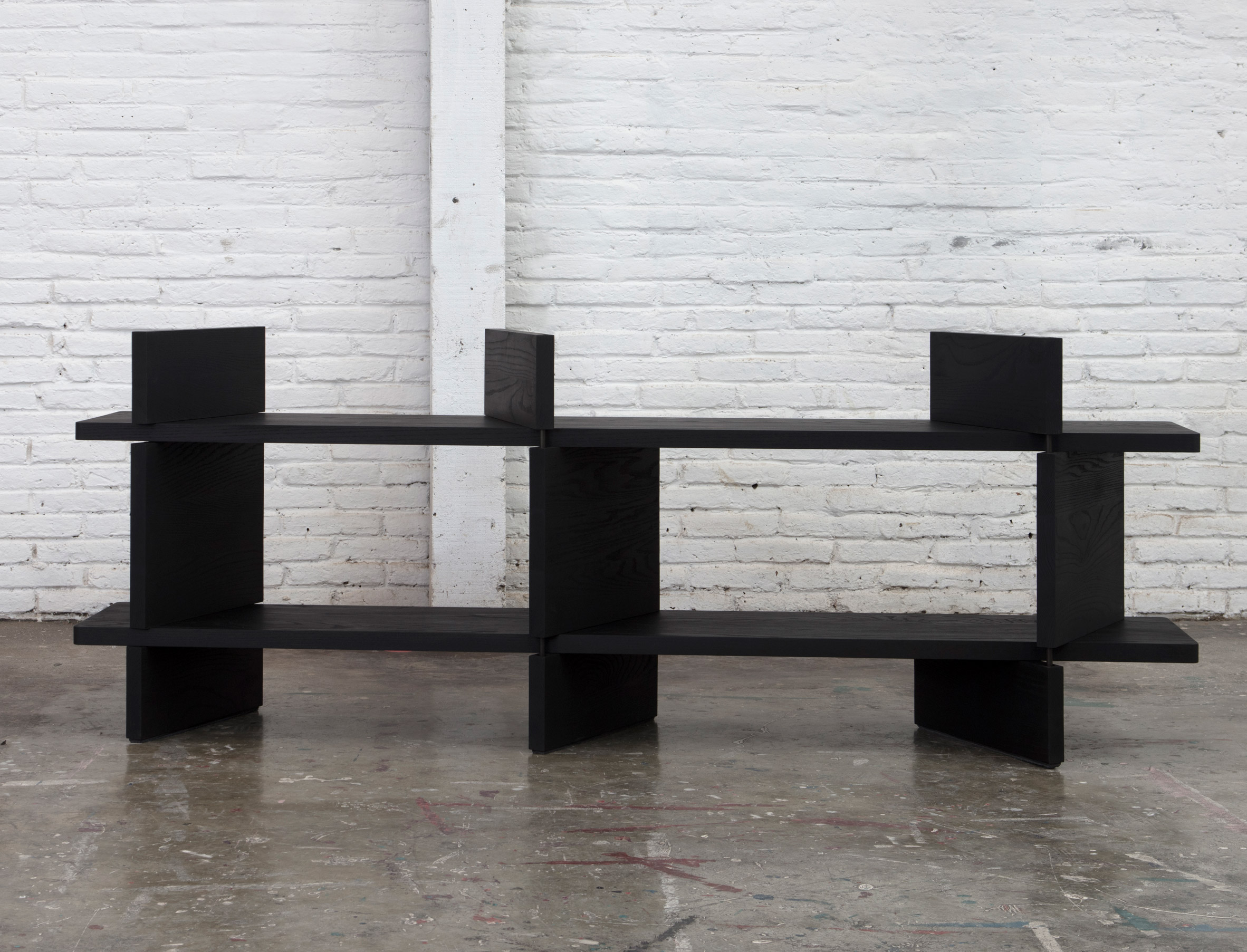 Esrawe exhibits black wooden furniture for Design Week Mexico