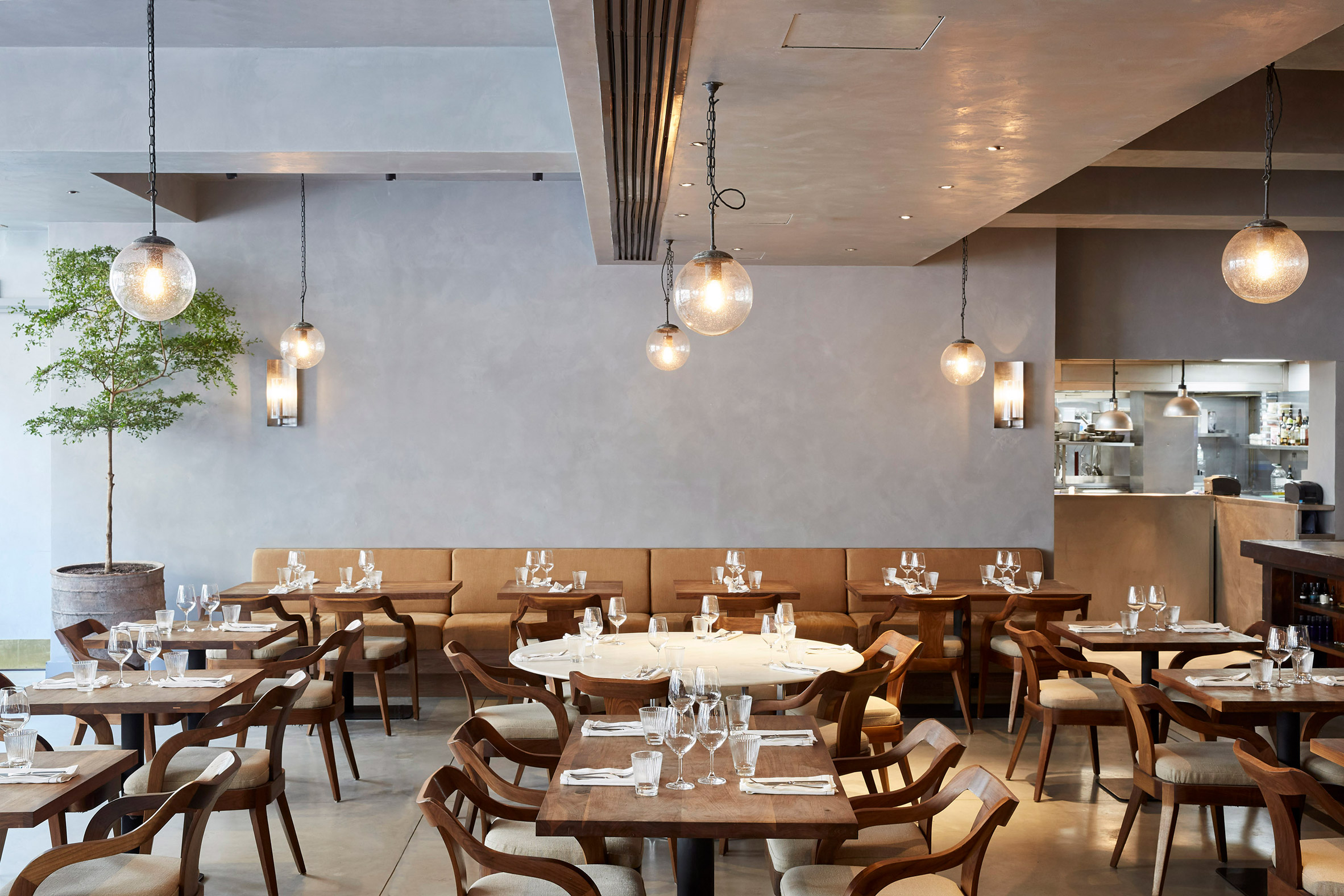Timber furnishings and open-fire cooking warm up concrete interiors of St Leonards restaurant