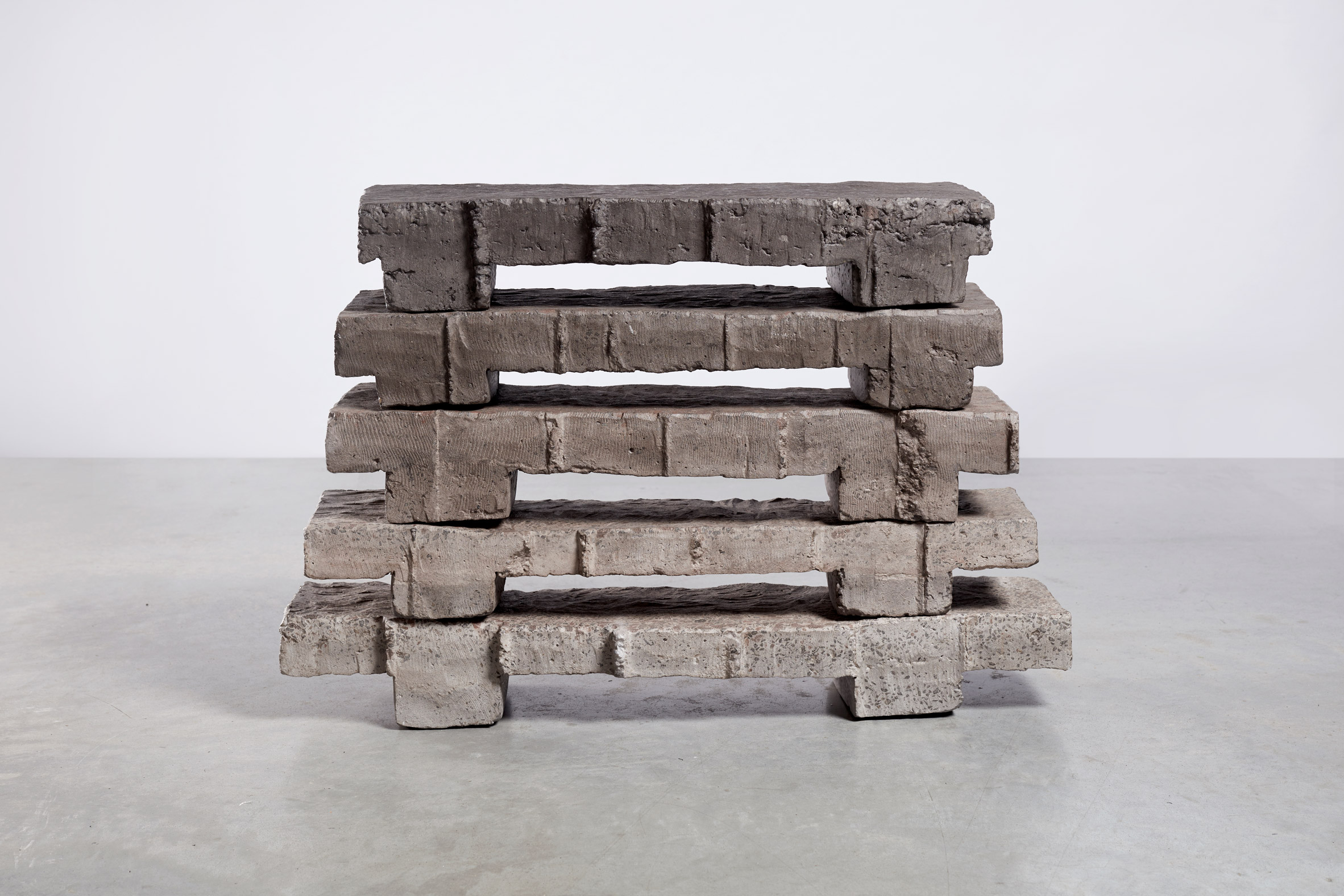 Bram Vanderbeke uses concrete waste blocks to create neolithic-looking furniture