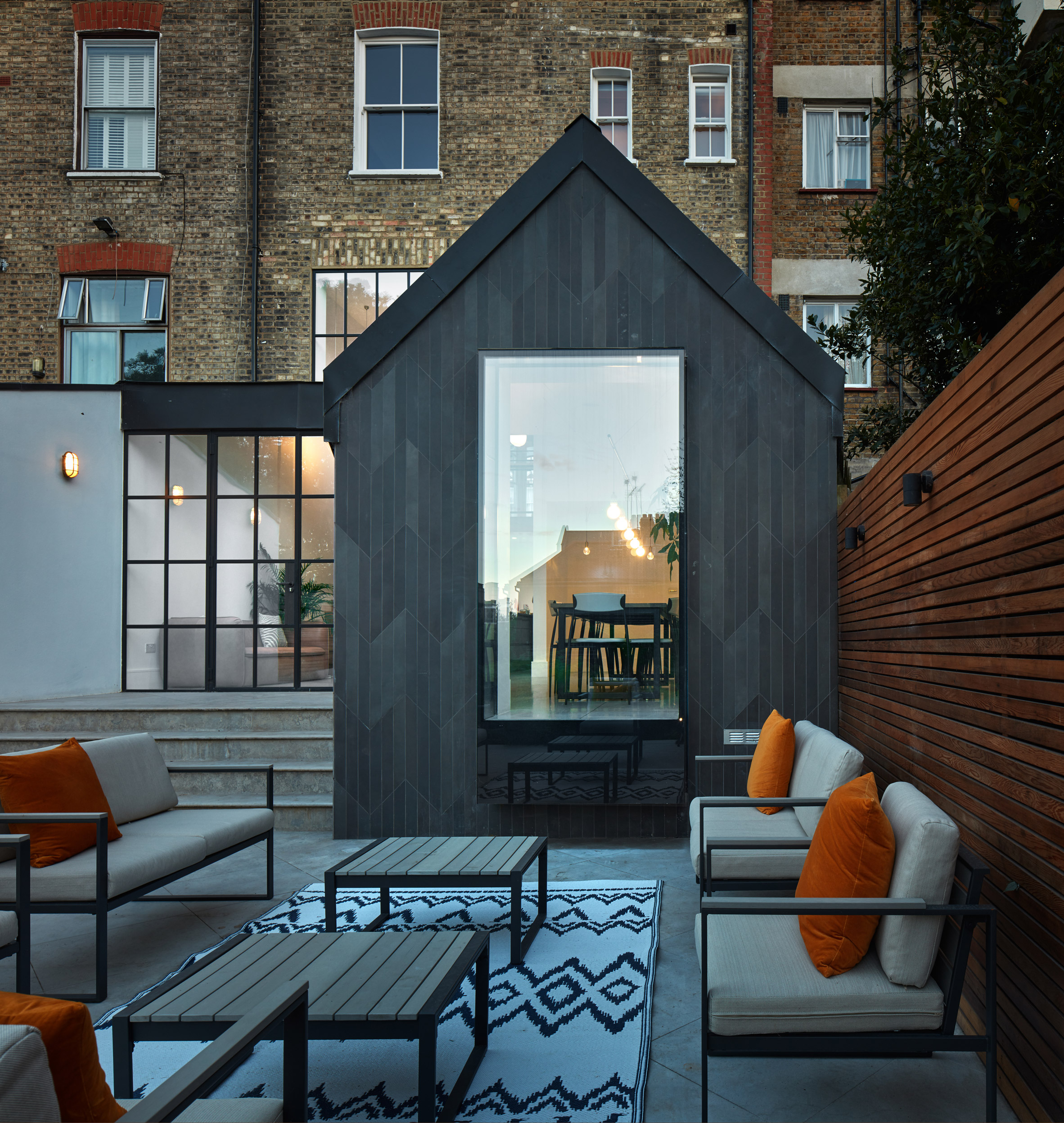 London townhouse updated with pared-back materials and patterns