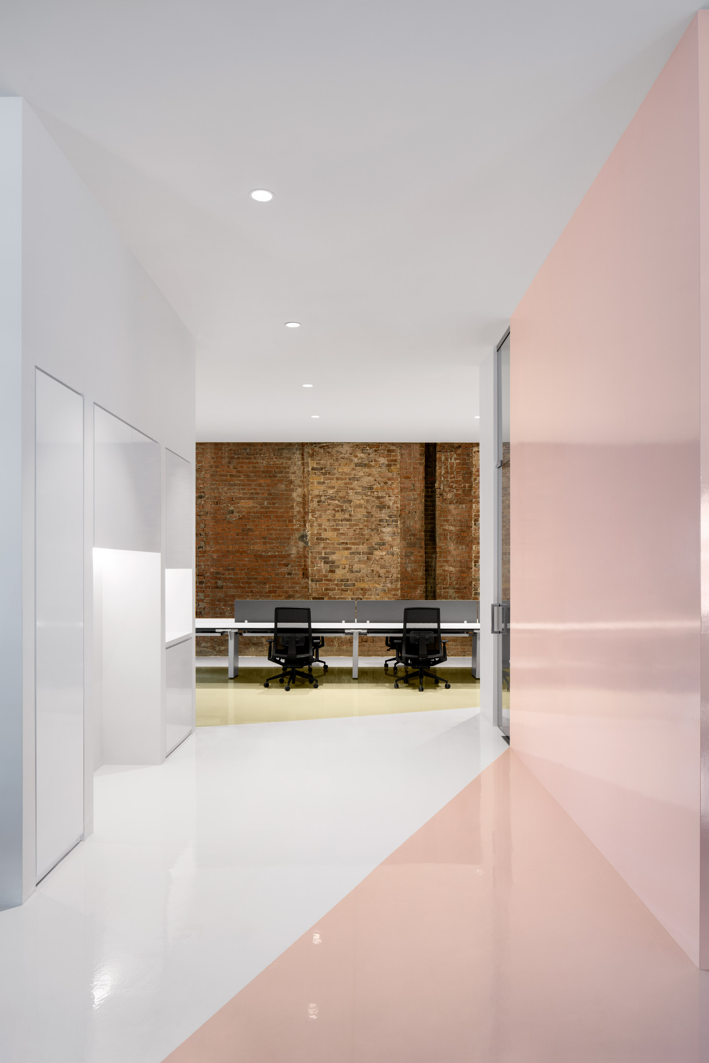 ACDF Architecture combines pastels and exposed brick at Lightspeed offices