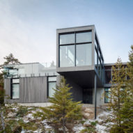 Monochrome ski chalet by Thellend Fortin overlooks Quebec's Saint Lawrence River