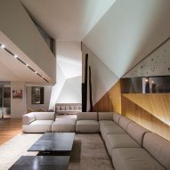 AGi Architects' Rock House features "origami-like" stone facades