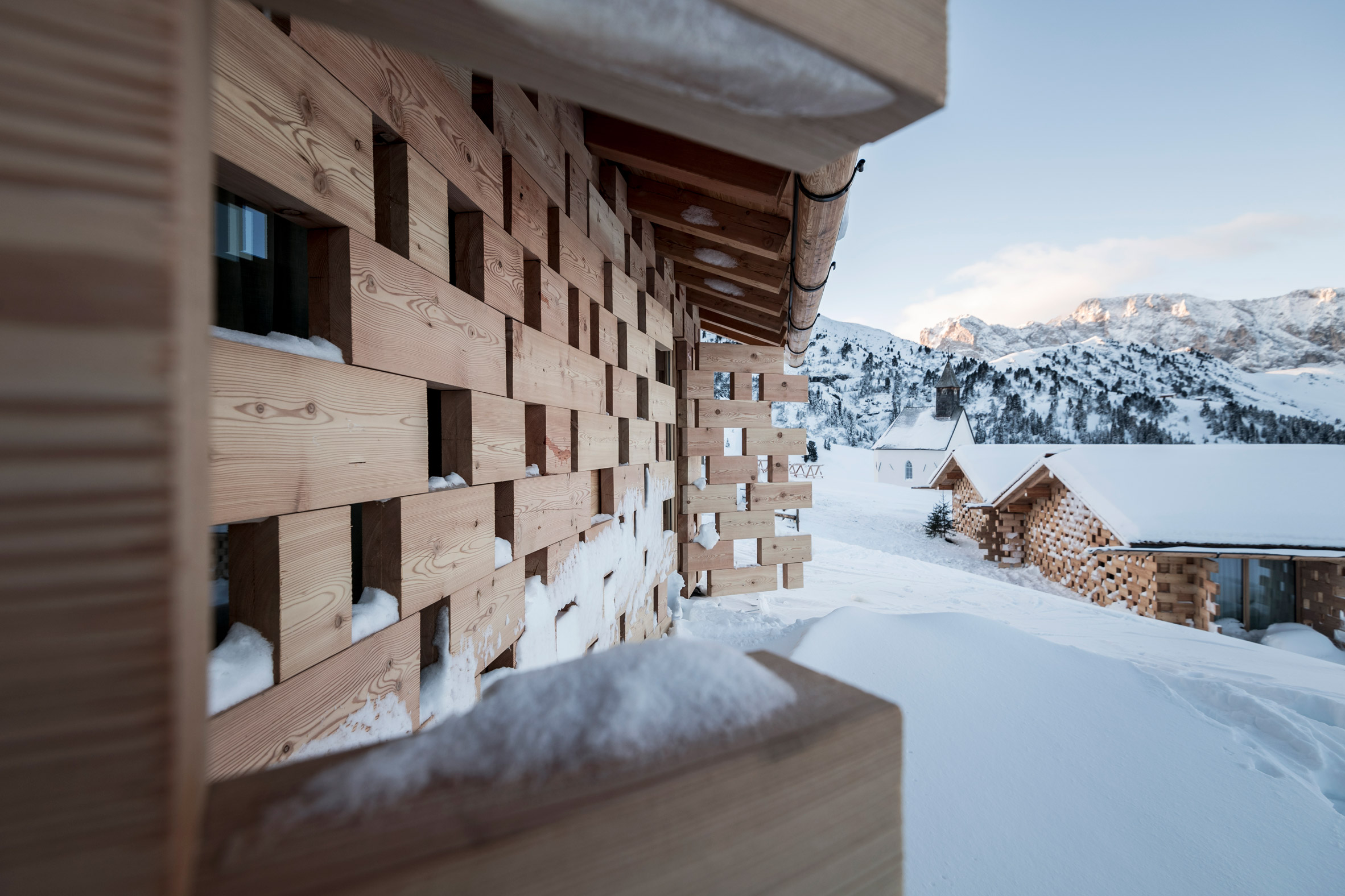 NOA extends historic Alpine retreat with cluster of cosy wooden chalets