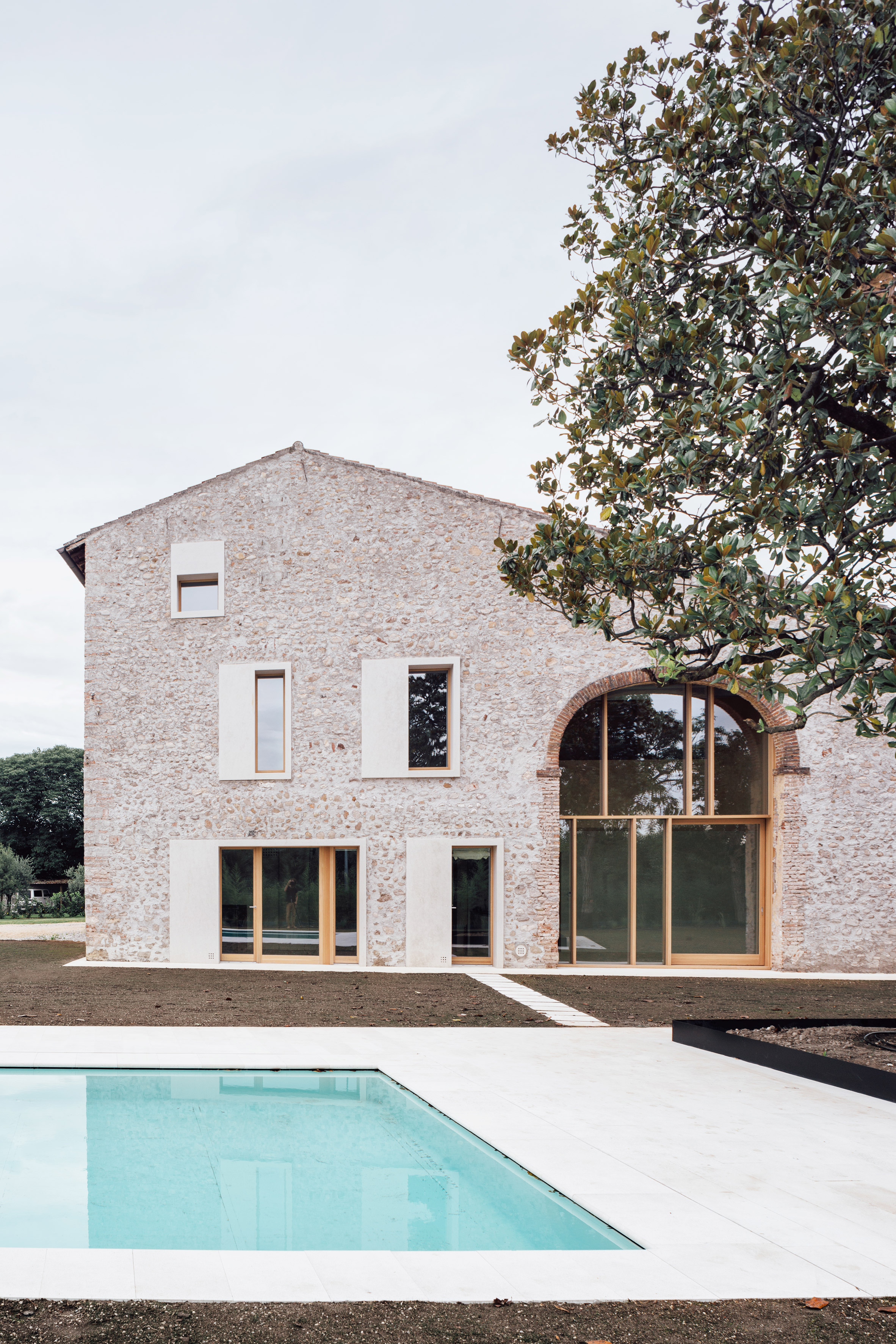 Studio Wok inserts home into stone barn in the Italian countryside