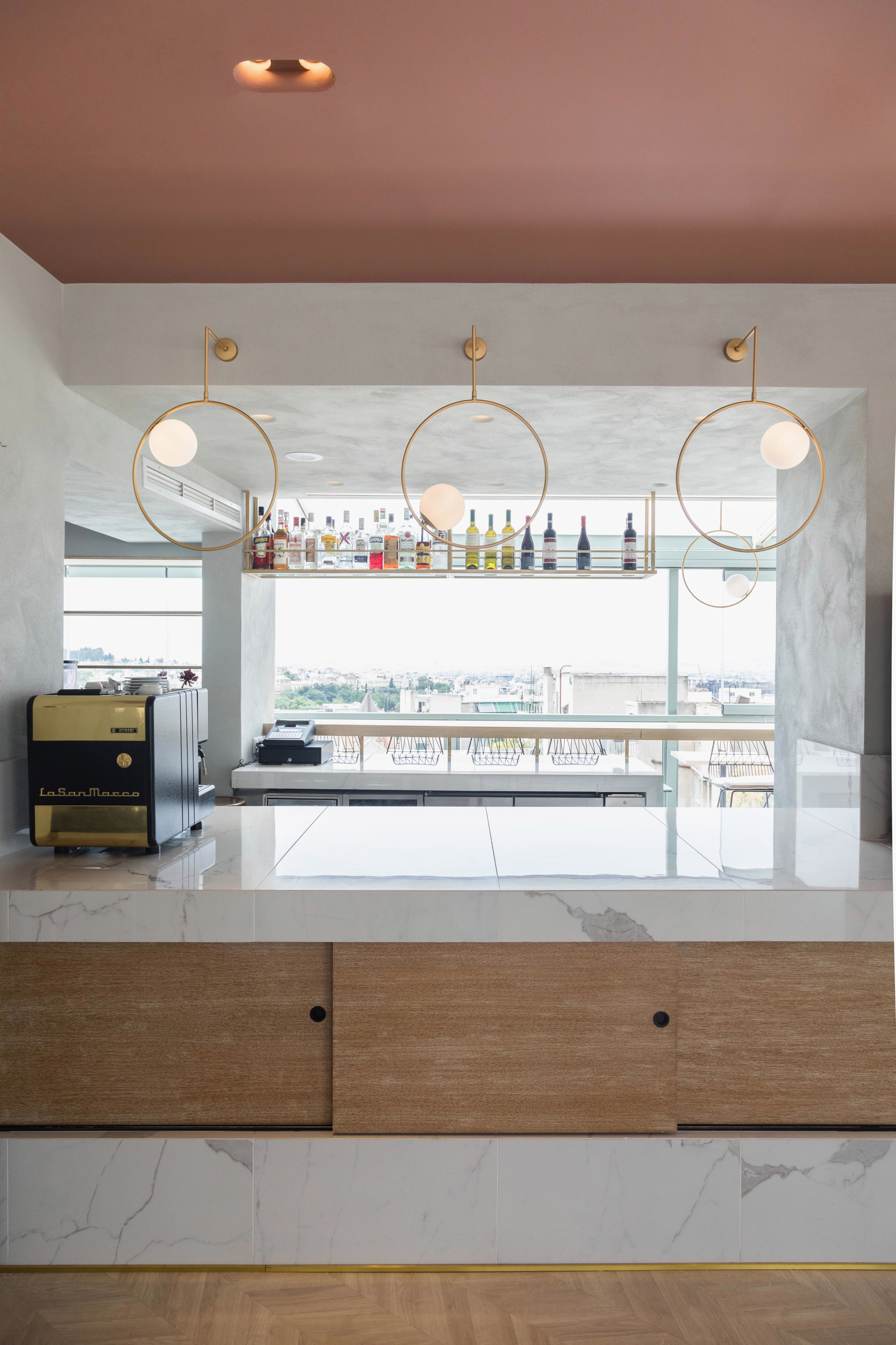 Fluo creates rooftop bar and breakfast room at Evripidis hotel in Athens