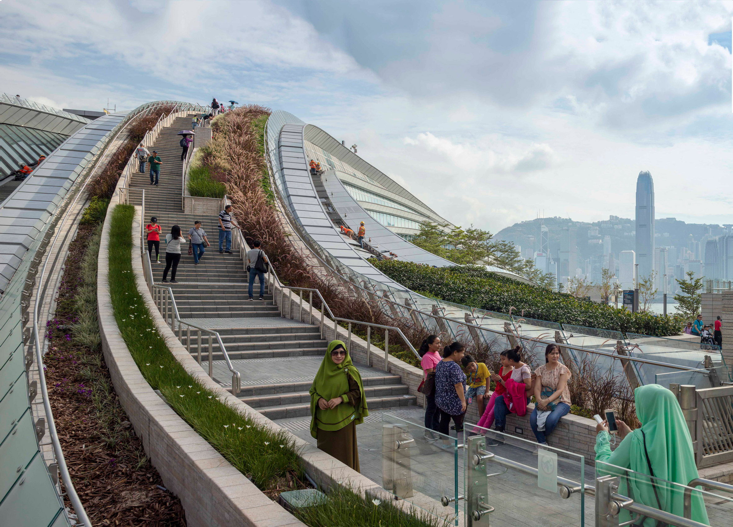 Arching rooftop walkway and garden tops West Kowloon Station in Hong Kong