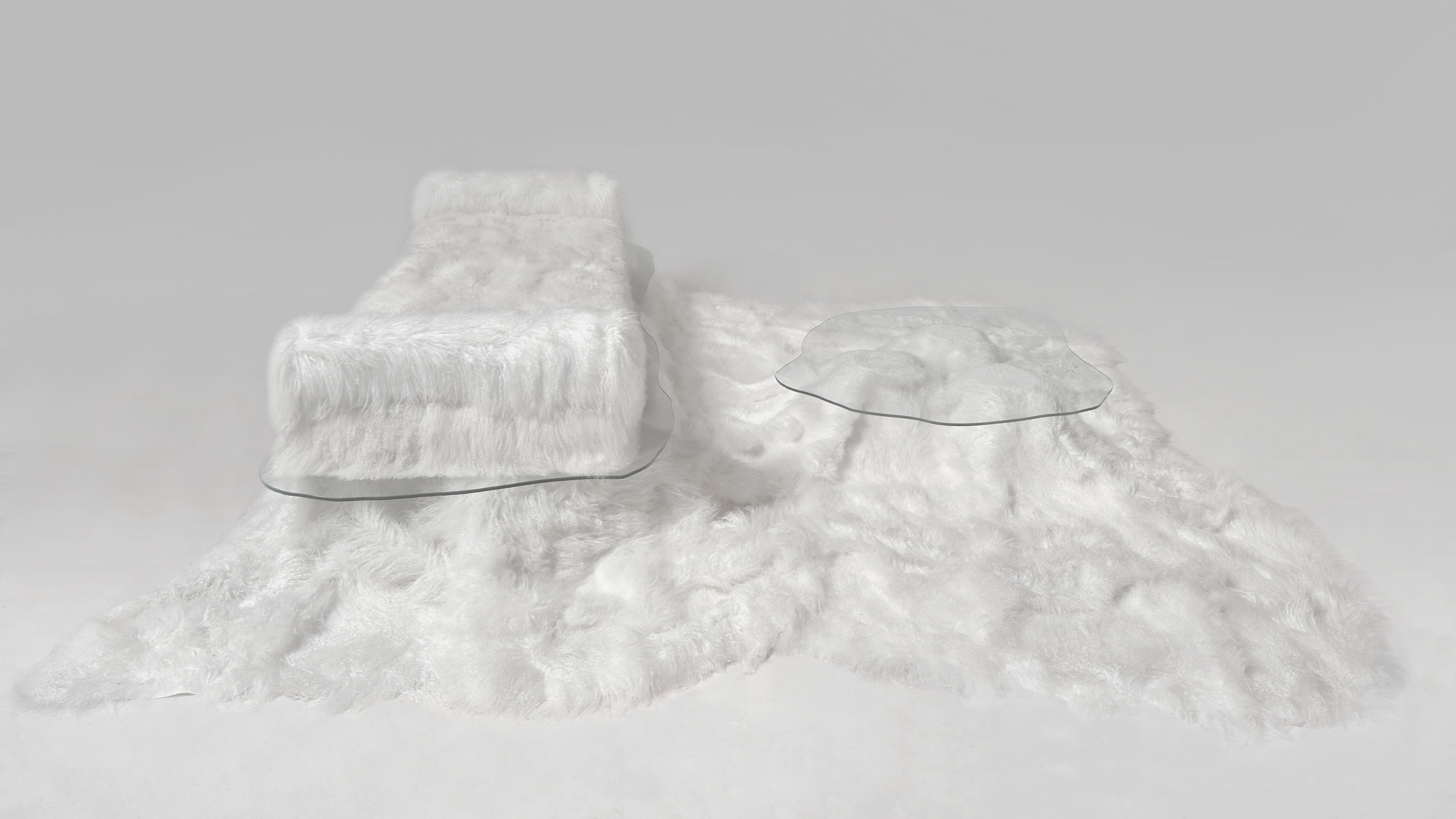 Sofa Pelo sheepskin daybed and table by Guillermo Santomá