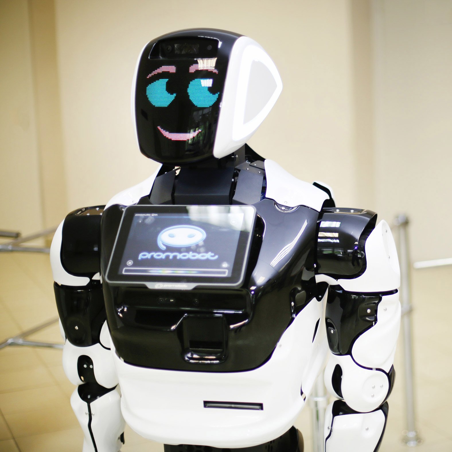 Promobot robot by self-driving Tesla on way to in Las Vegas