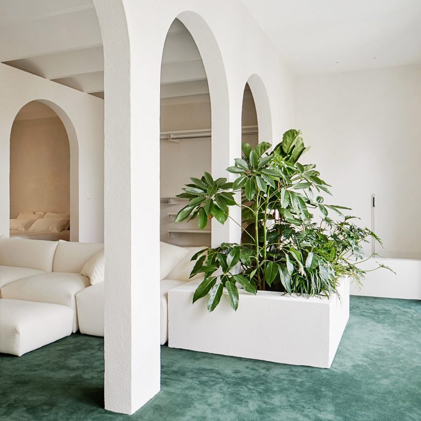 Archways appear throughout Penthouse in Barcelona by PMAA