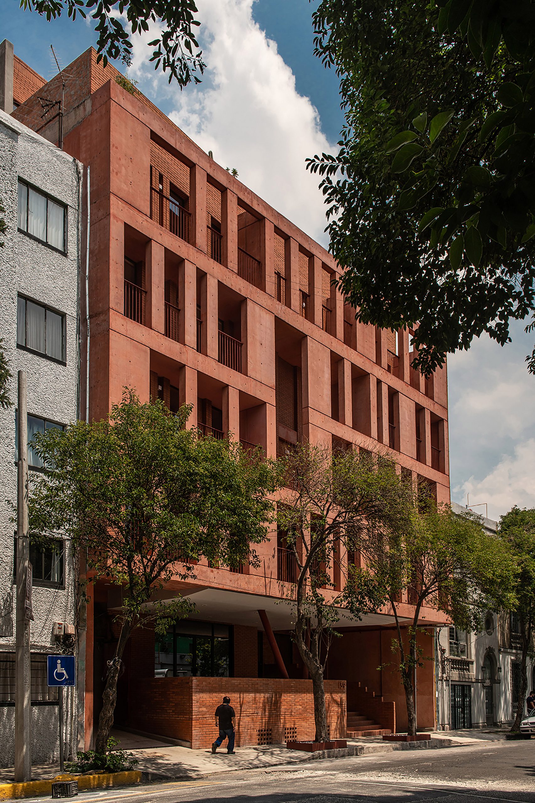 Red brick and tinted concrete form CPDA’s 139 Schultz housing block in ...