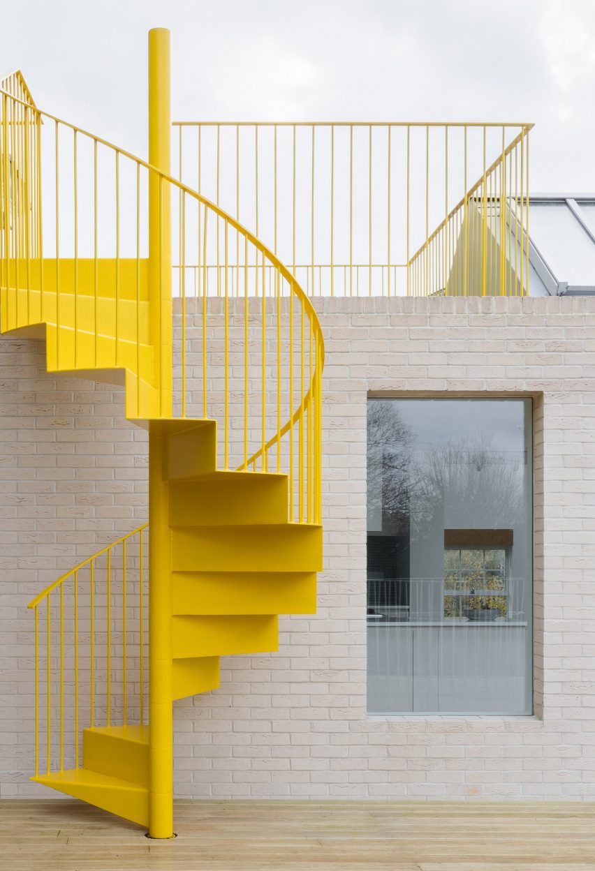 Yellow staircase at Mile End Road apartment by Vine Architecture Studio