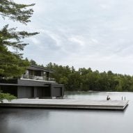 Charred cedar clads Ontario lake boathouse by Akb Architects
