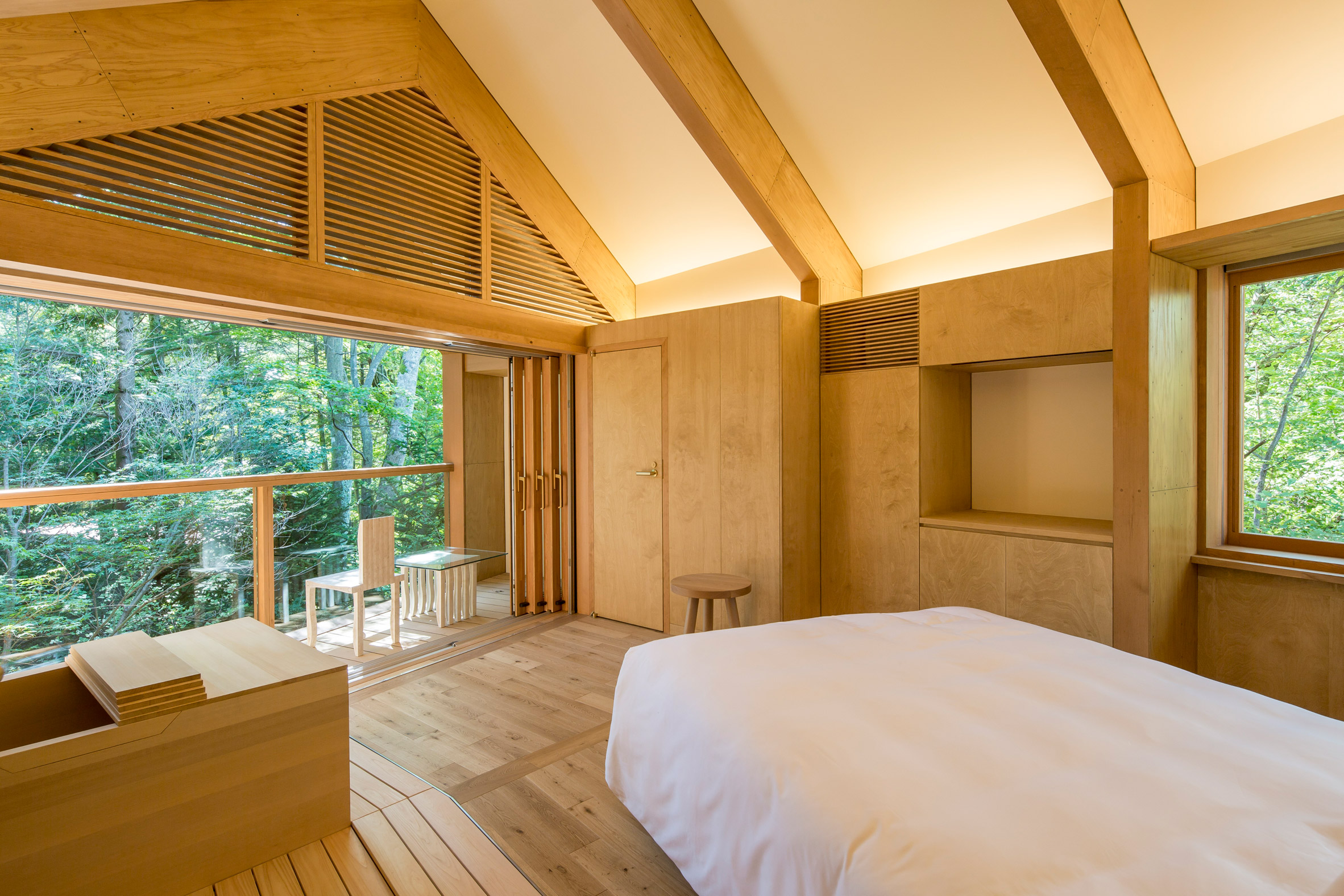 Shigeru Ban designs Shishi-Iwa House boutique hotel that winds through  woodland in Japan