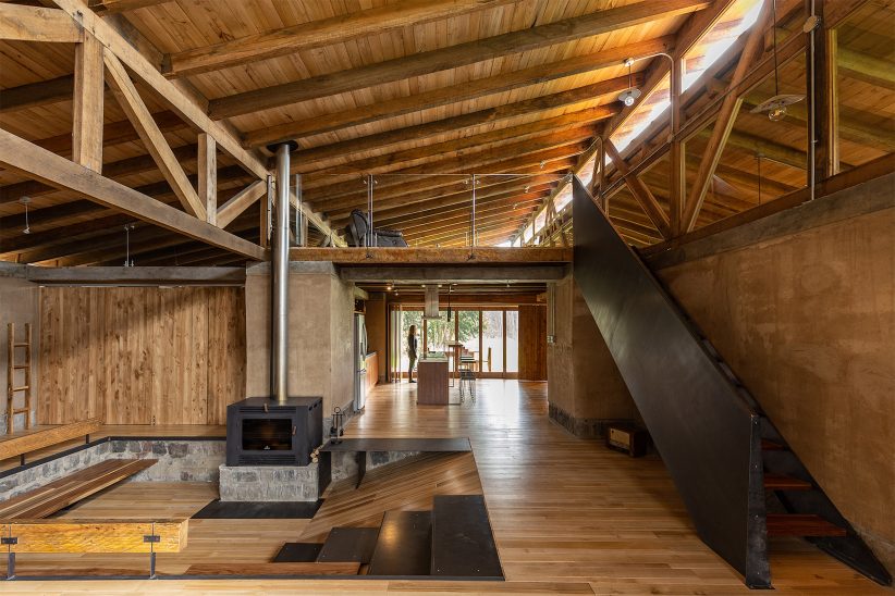 Angled roof tops rammed-earth walls of Rama Estudio's Casa ...