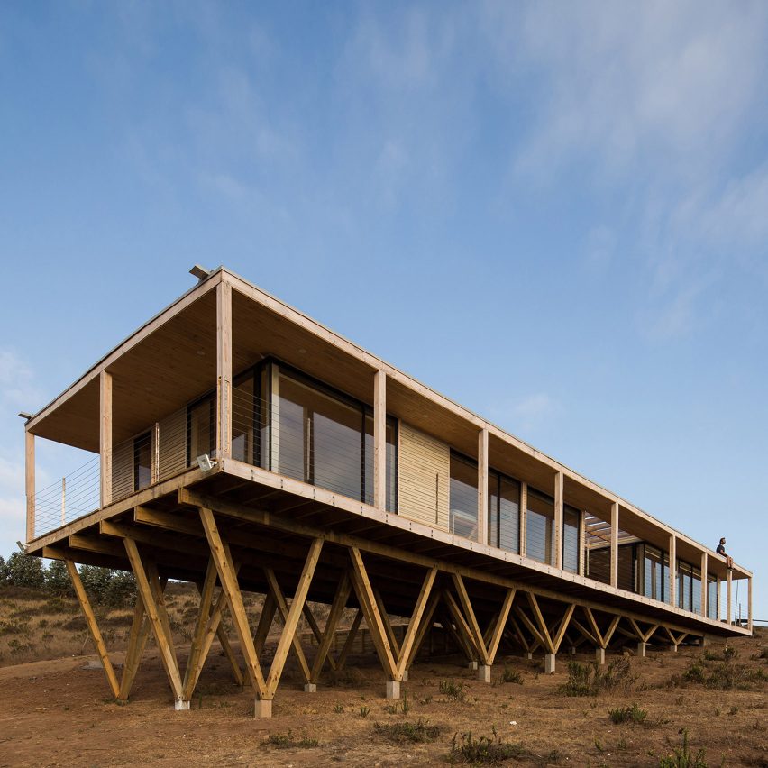 Dock House in coastal Chile by SAA rests on triangular wooden stilts