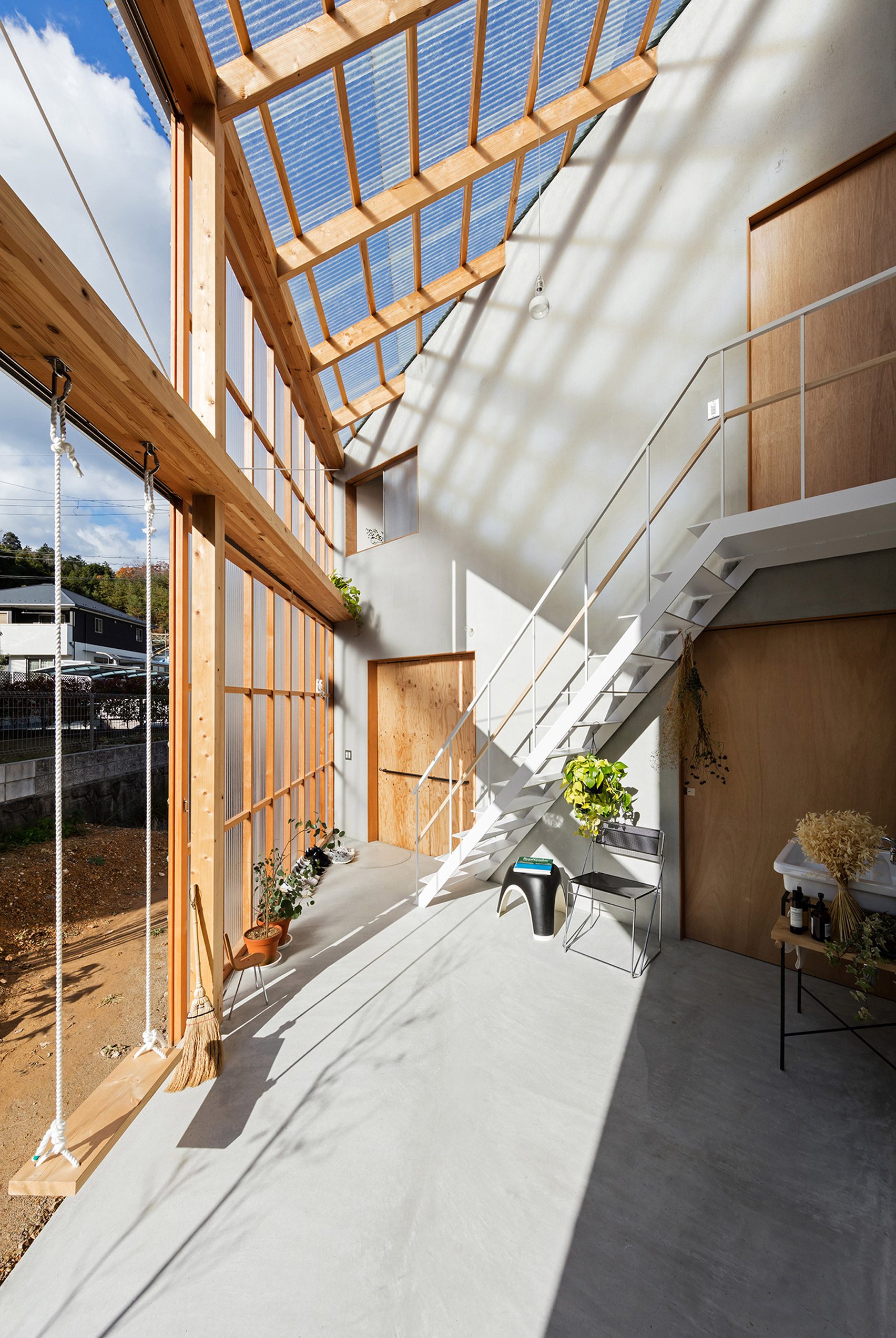 Huge Sliding Door Reveals Courtyard At House In Sonobe By Tato Architects